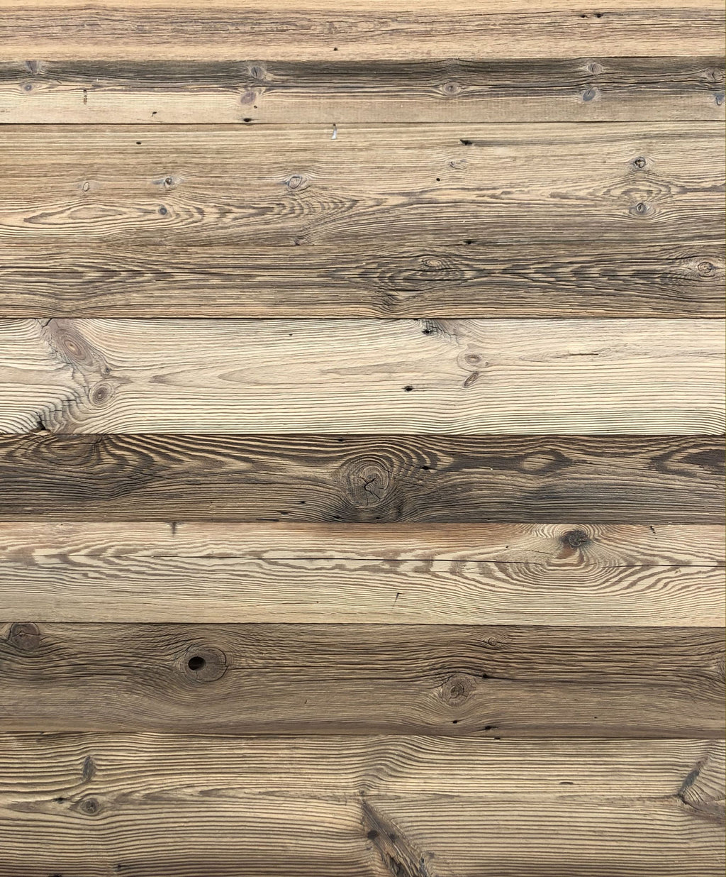 Aged reclaimed wood boards for rustic wall cladding