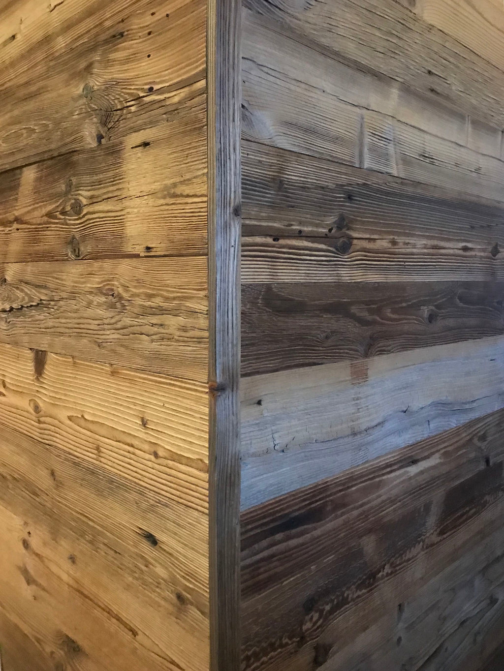 Sunburnt brown reclaimed wood installed as wall cladding