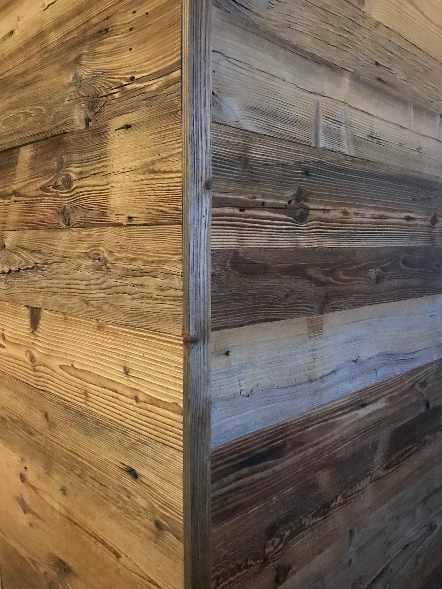 Sunburnt brown reclaimed wood installed as wall cladding