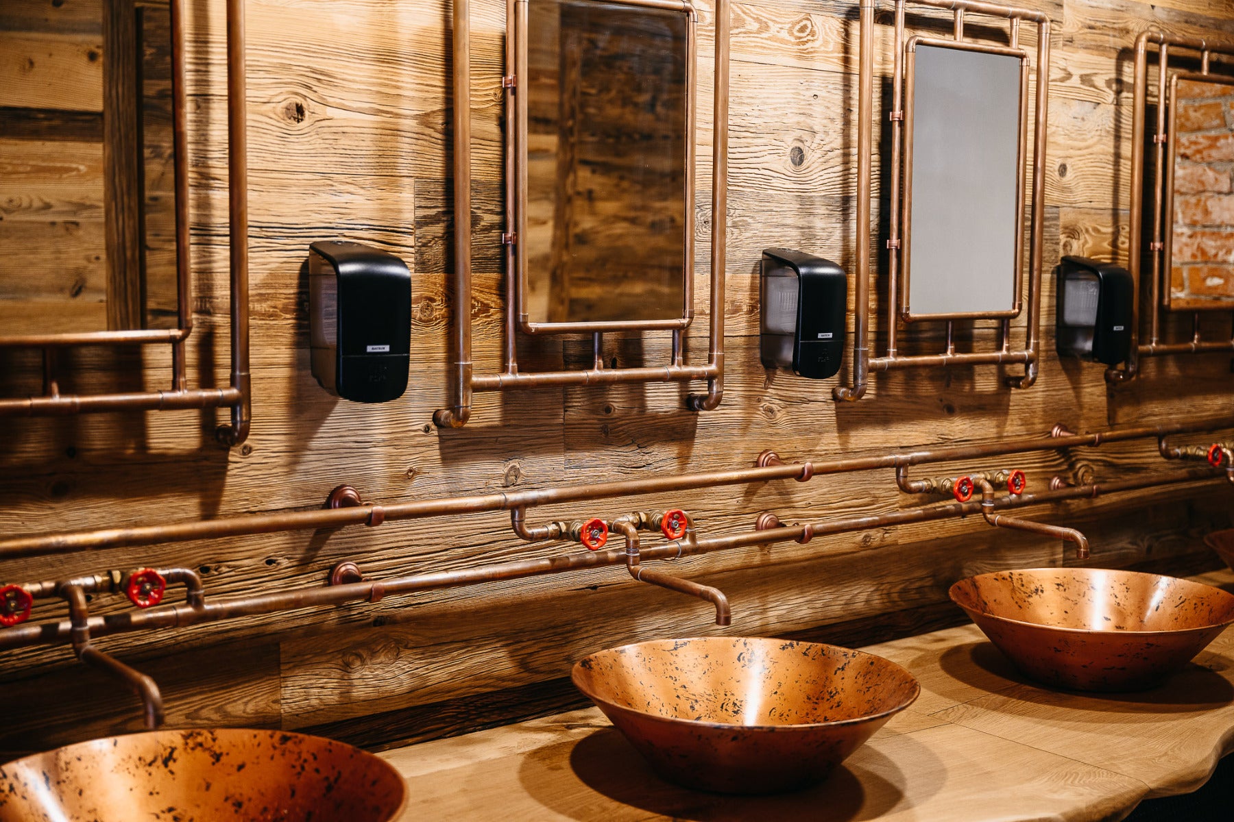 Sunburnt reclaimed wood wall cladding in a bathroom interior