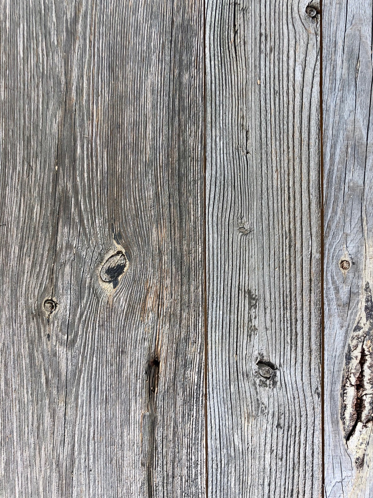 Reclaimed wood boards used as rustic wall cladding by Vintage Holz