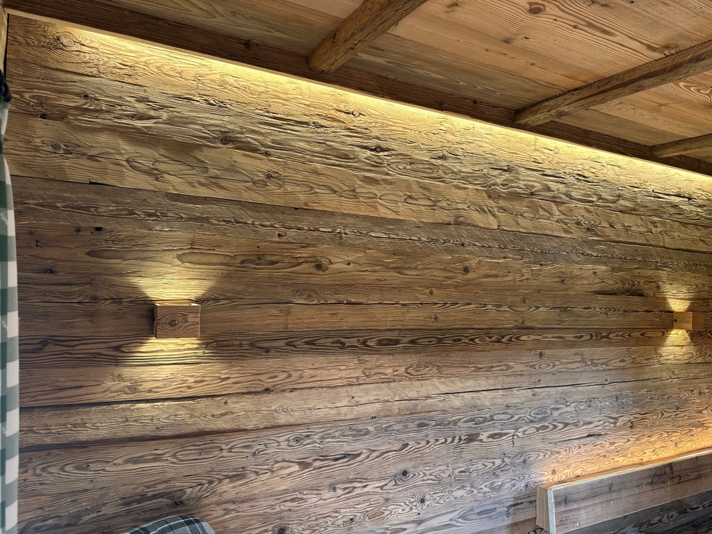Rustic wall cladding made from authentic hand-hewn reclaimed wood boards