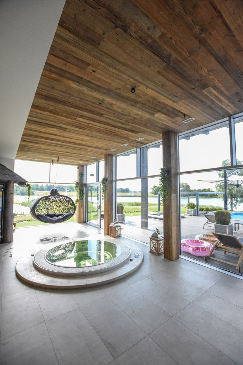 Reclaimed wood tongue and groove boards used as ceiling cladding