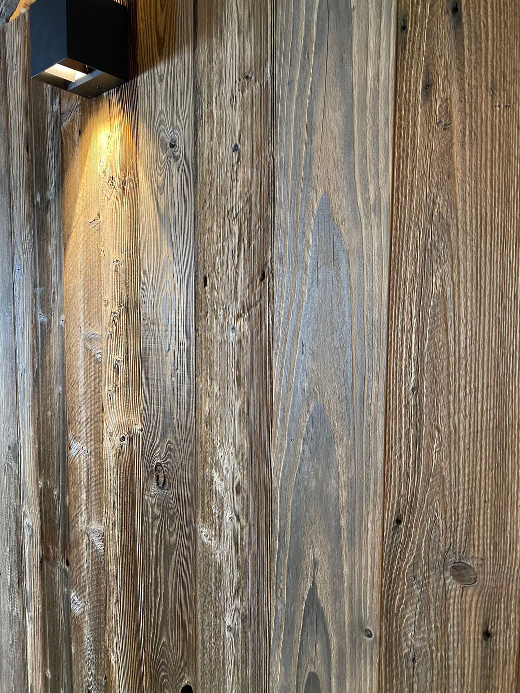 Sunburnt reclaimed wood used as exterior façade cladding