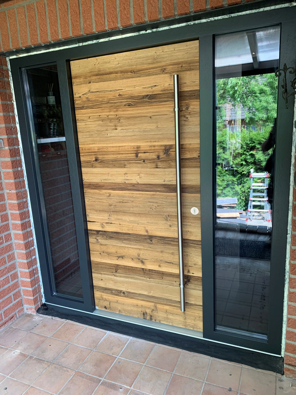 Vario Brown reclaimed wood used to clad an entrance door