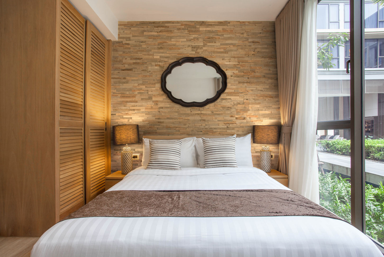 ALM S reclaimed wood wall panels used as a bedroom feature wall