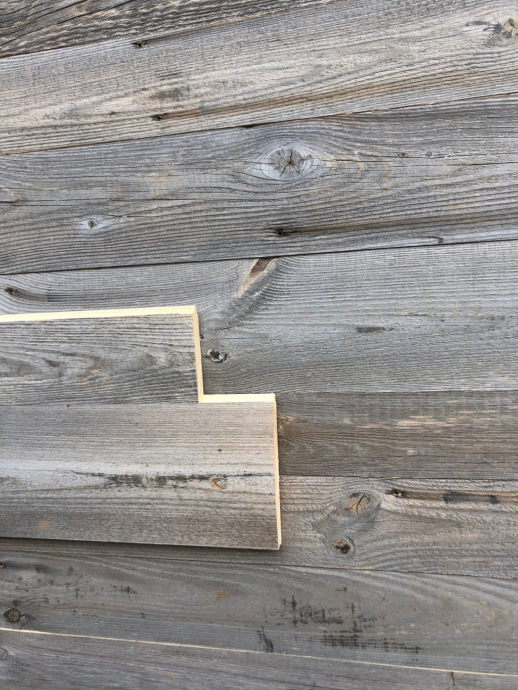 Sunburnt grey reclaimed wood wall cladding with naturally weathered patina
