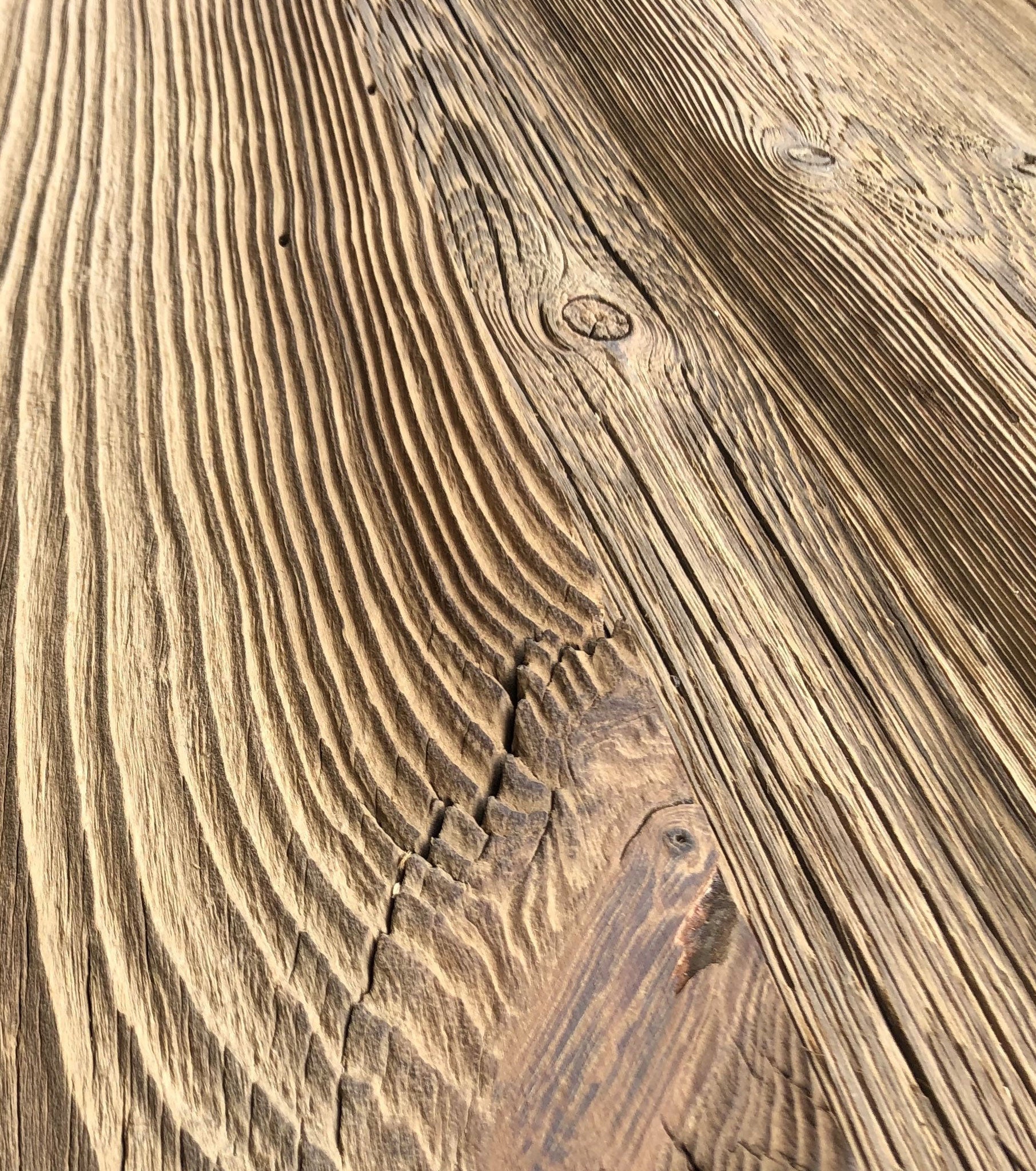Rustic reclaimed wood boards with sun-aged brown patina