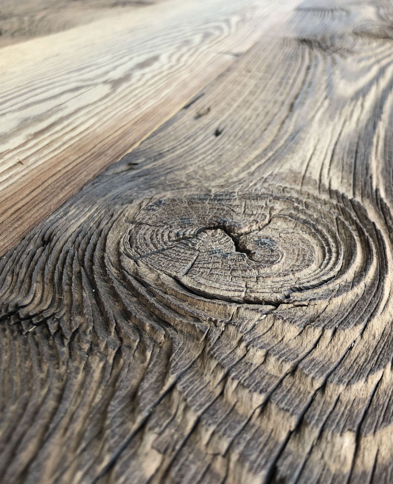 Rustic reclaimed wood feature wall with natural brown tones
