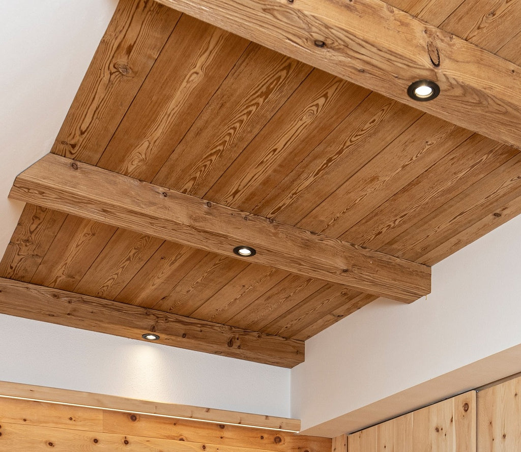Steamed larch tongue and groove boards installed as ceiling cladding