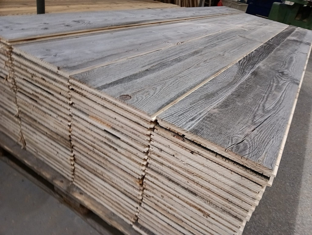 Grey reclaimed wood three-layer wall panel with naturally weathered chalet appearance