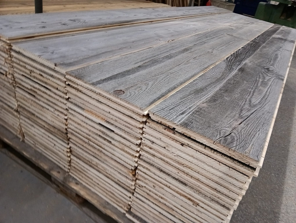 Grey reclaimed wood three-layer wall panel with naturally weathered chalet appearance