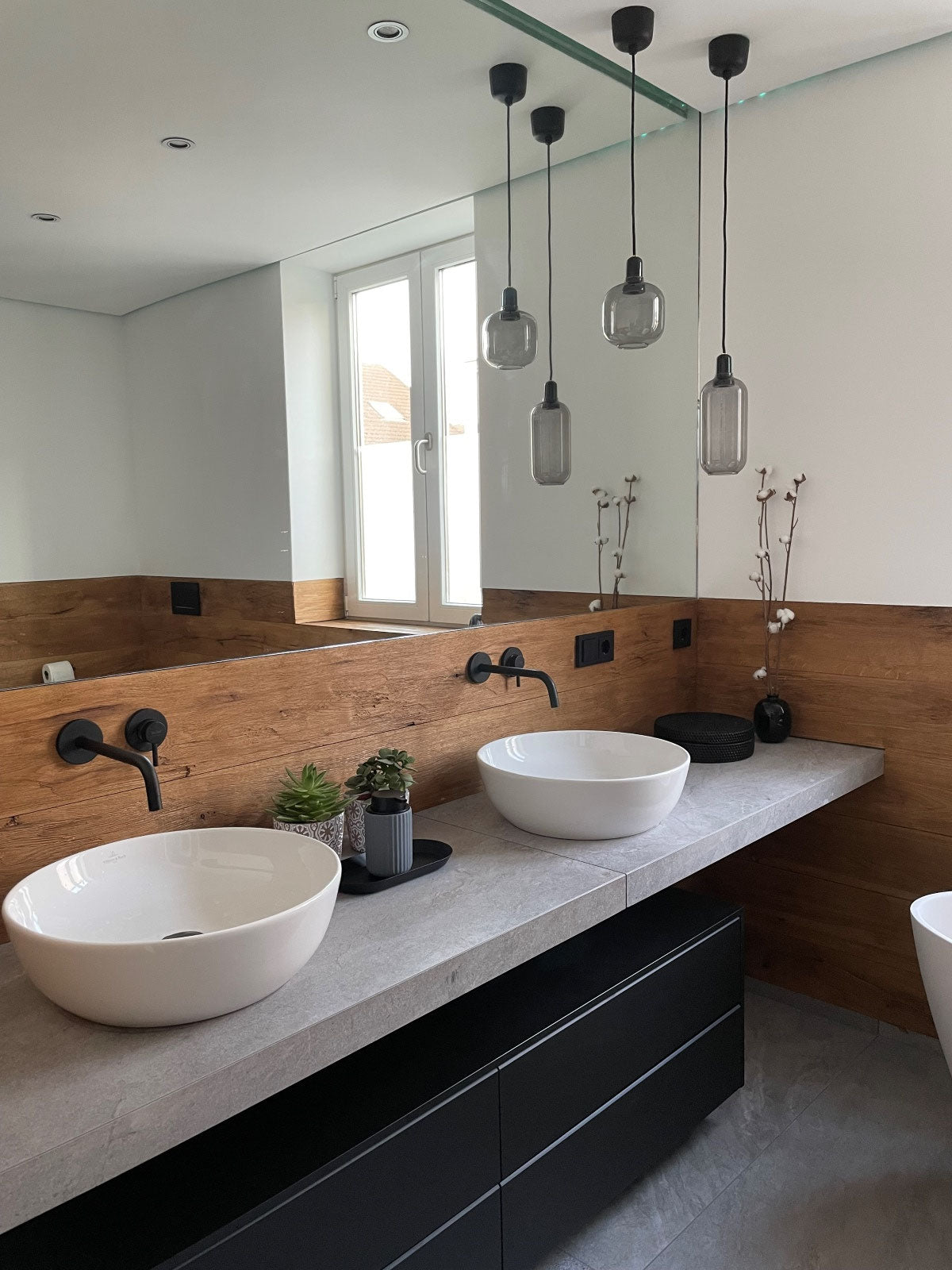 Oiled hewn and brushed oak wall cladding installed in a bathroom