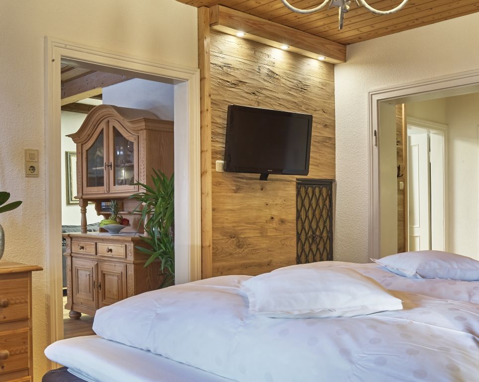 Rustic oak tongue and groove wall cladding used for a TV feature wall