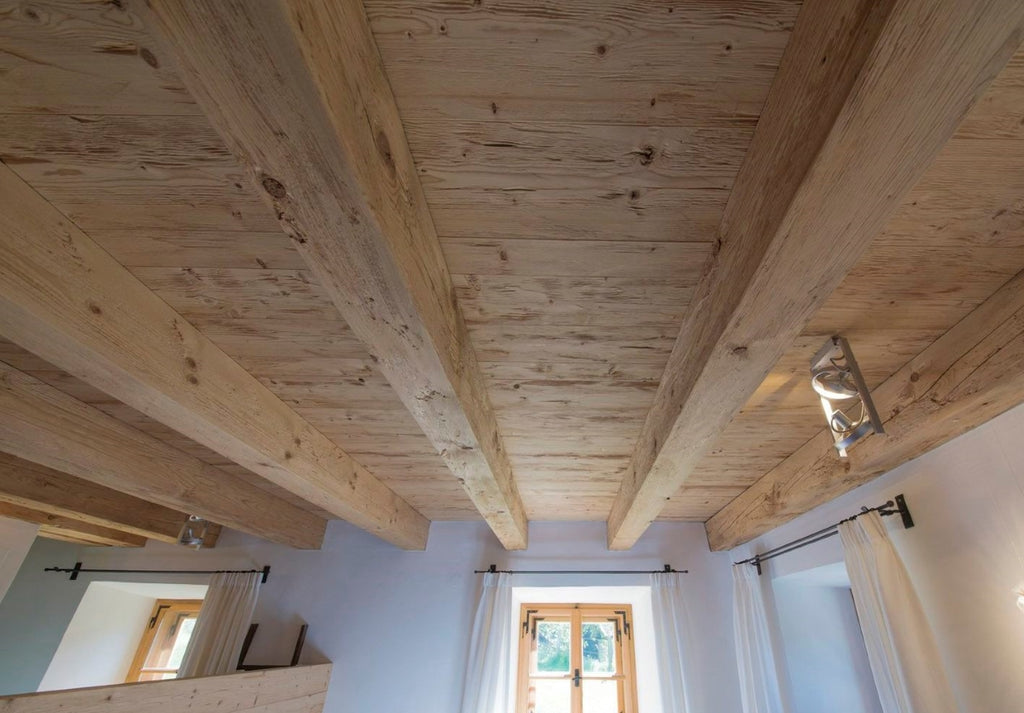 Spruce tongue and groove wall boards with rustic timber beams