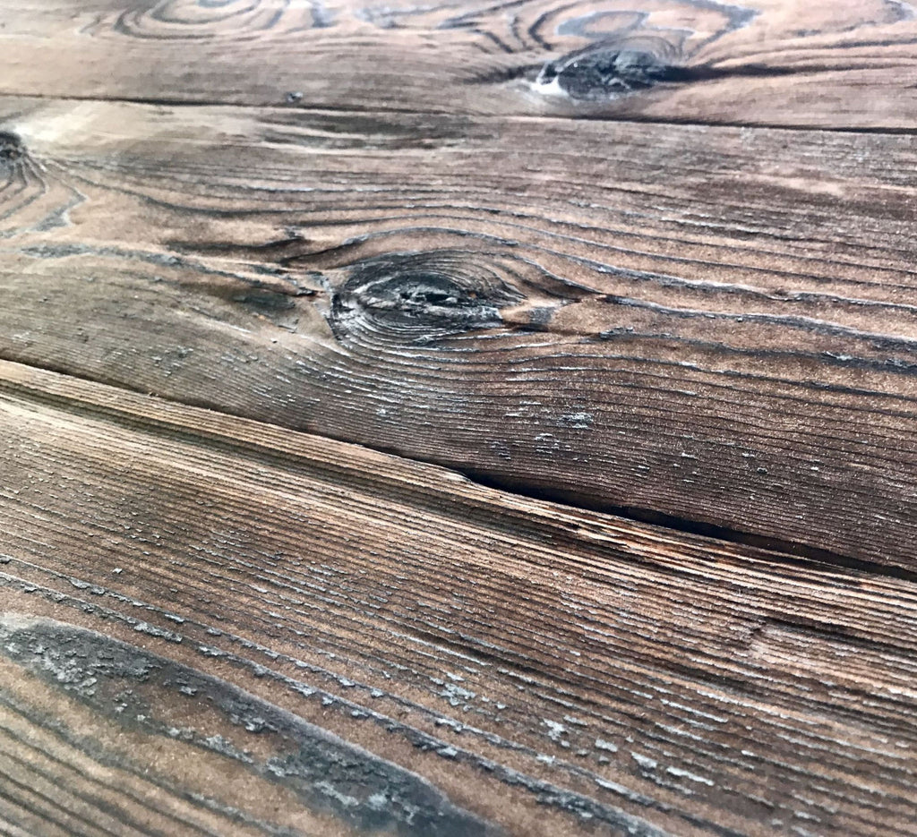 Hewn and burnt spruce wall cladding by Vintage Holz