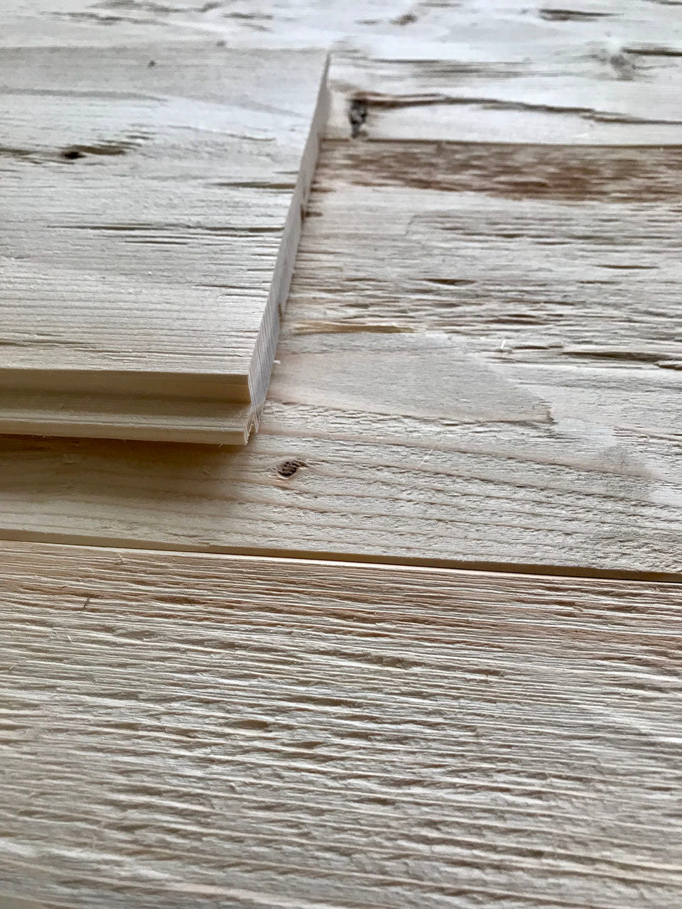 Spruce tongue and groove boards installed as natural wall cladding