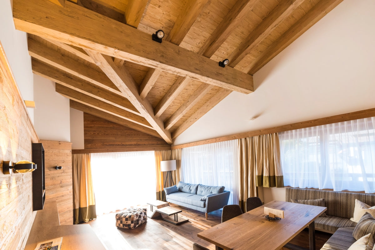 Hewn and brushed steamed spruce wall panels with warm natural colour