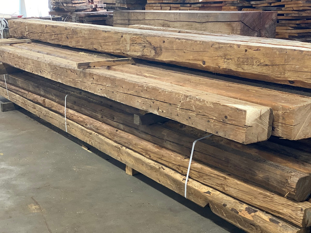 Hand-hewn reclaimed wood beams made from recycled timber with rustic surface