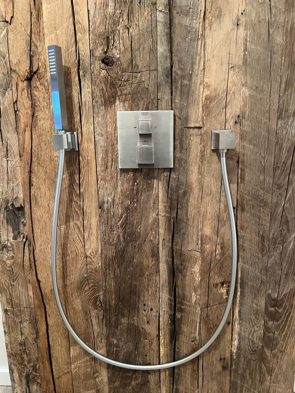 Hand-hewn reclaimed oak wall cladding in natural wood tones