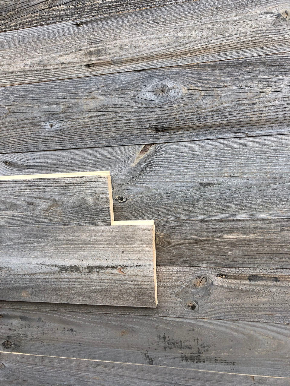 Sunburnt grey reclaimed wood tongue and groove wall cladding