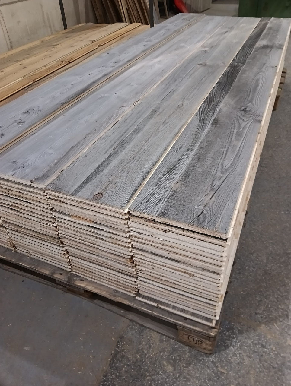 Grey reclaimed wood three-layer tongue and groove panel for chalet wall cladding