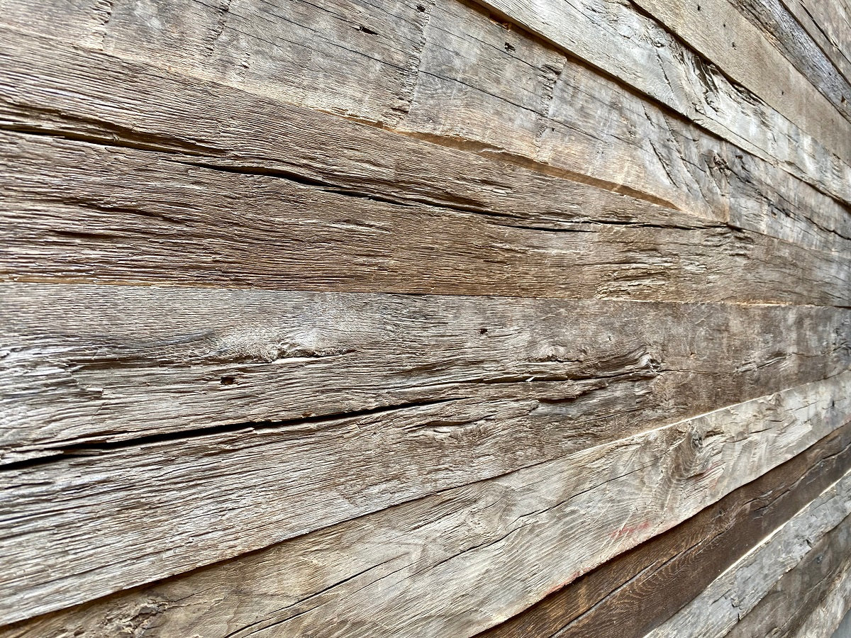 Hand-hewn reclaimed oak boards with authentic aged surface