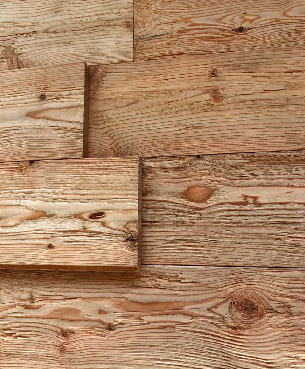 Larch tongue and groove wall cladding with hewn and brushed rustic surface