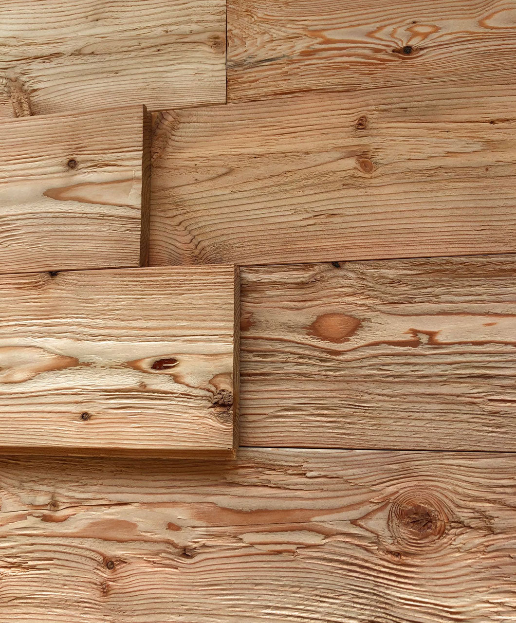 Larch tongue and groove wall cladding with hewn and brushed rustic surface