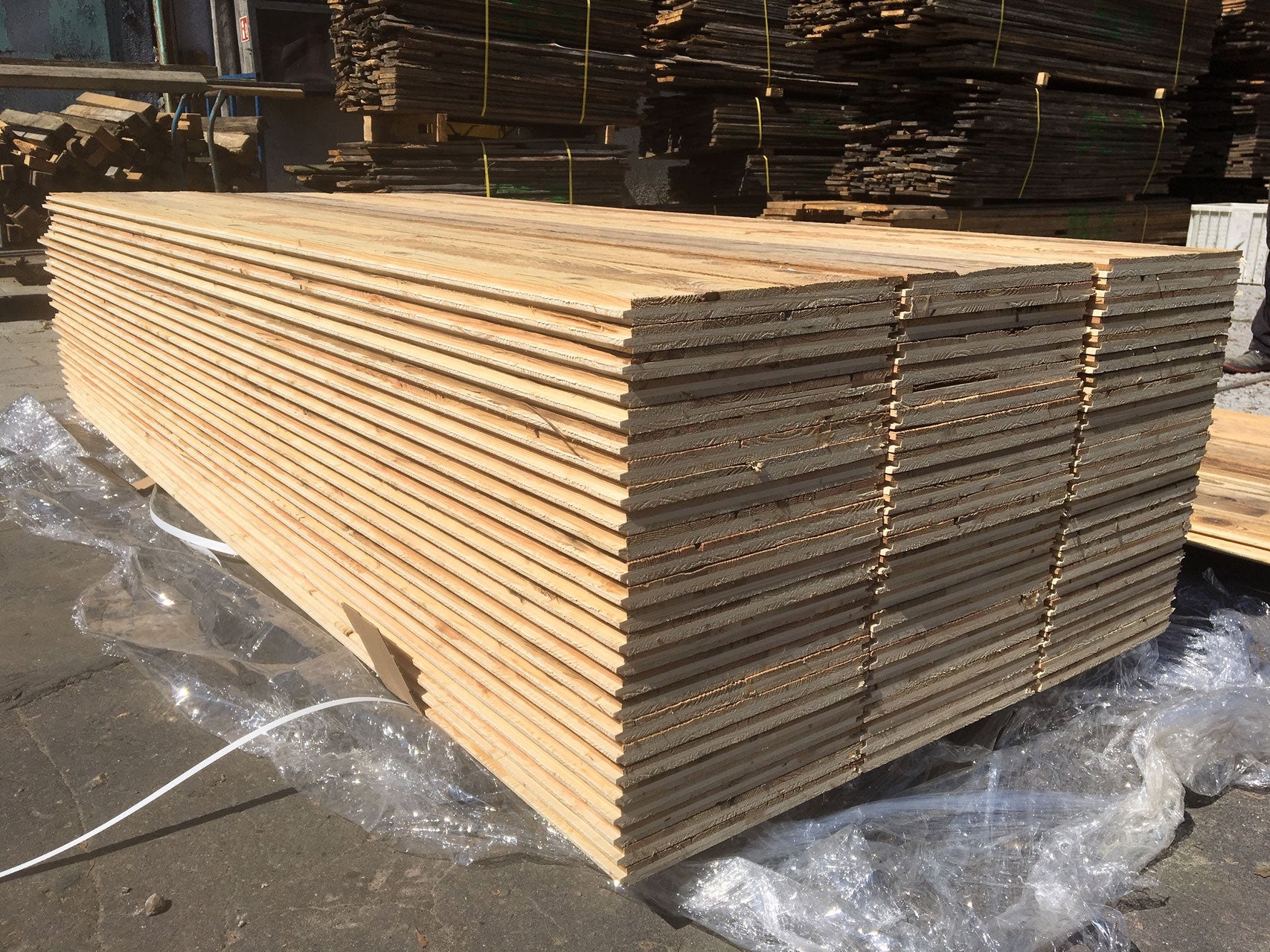 Sunburnt brown reclaimed wood three-layer tongue and groove panel for rustic wall cladding