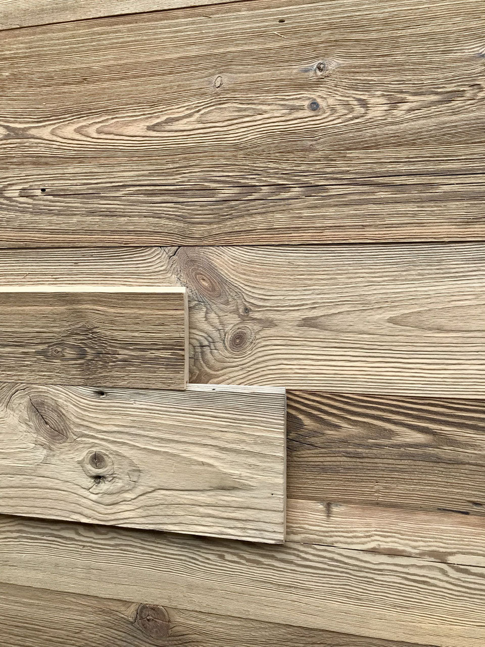 Sunburnt brown reclaimed wood tongue and groove wall cladding