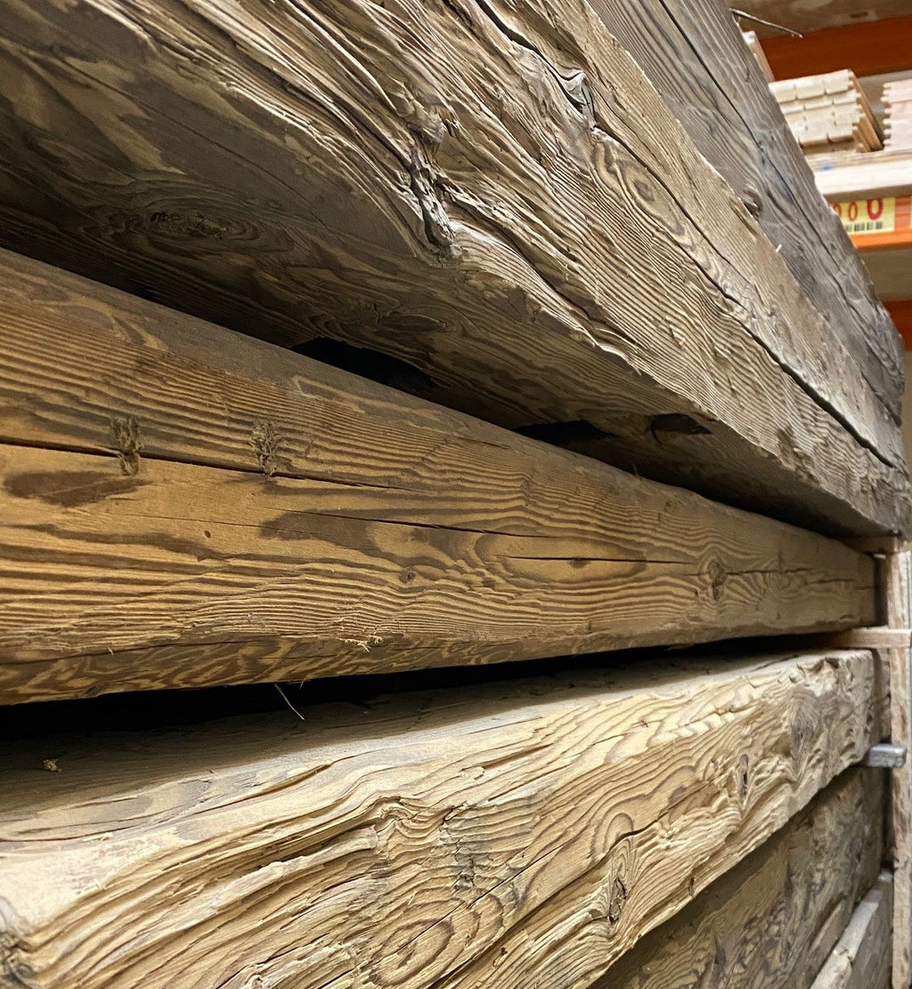 Hand-hewn reclaimed wood beam with authentic rustic aged surface