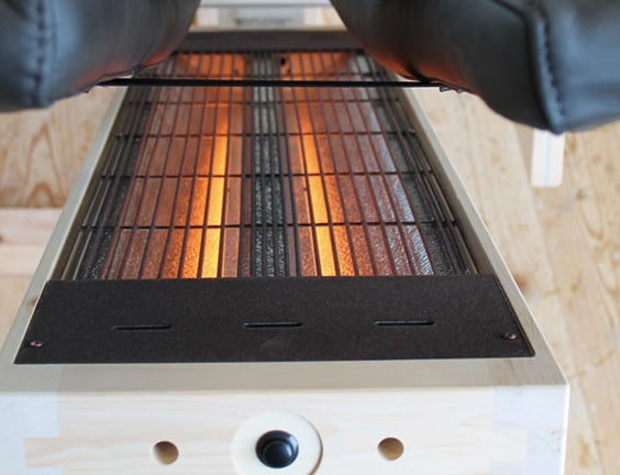Infrared lounger upholstery and wood finish detail
