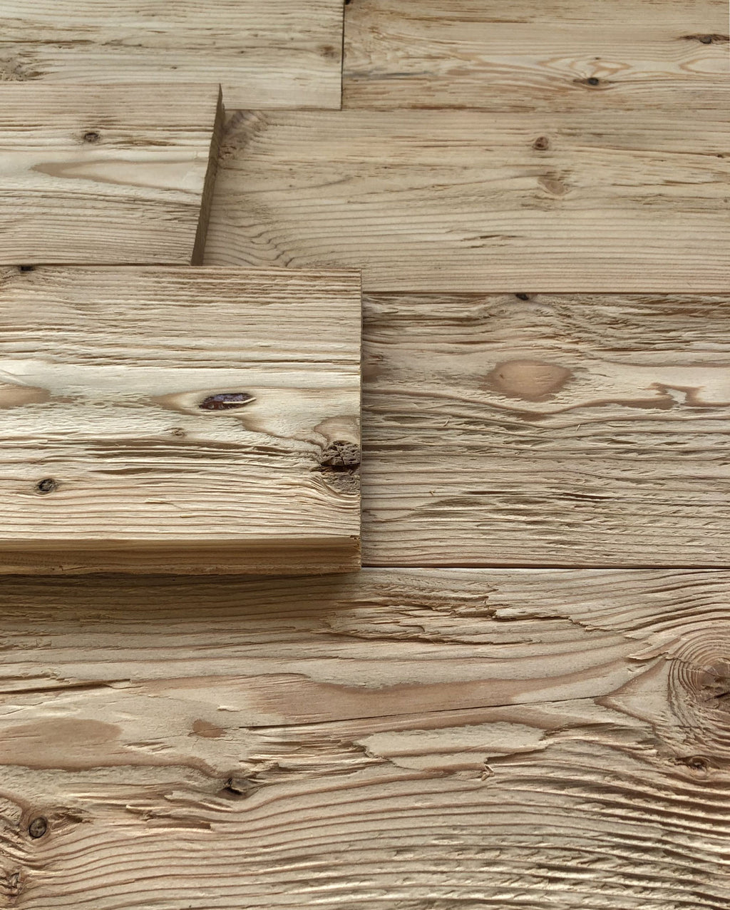 Hewn and brushed larch wall cladding with tongue and groove profile