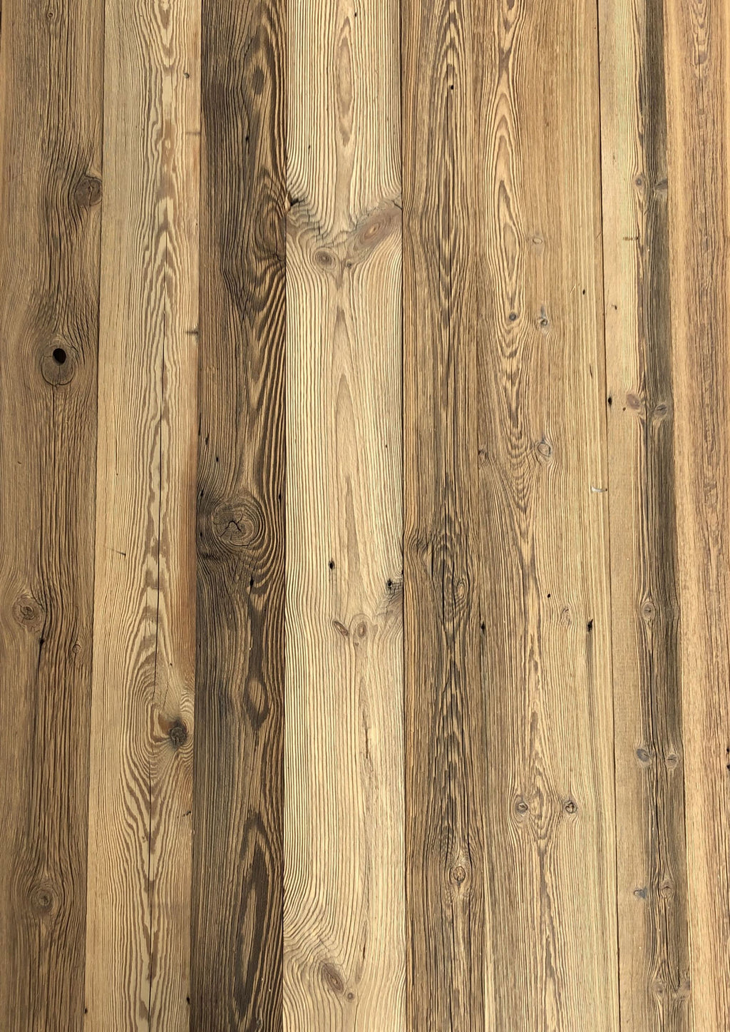 Rustic wall cladding made from sun-aged reclaimed wood