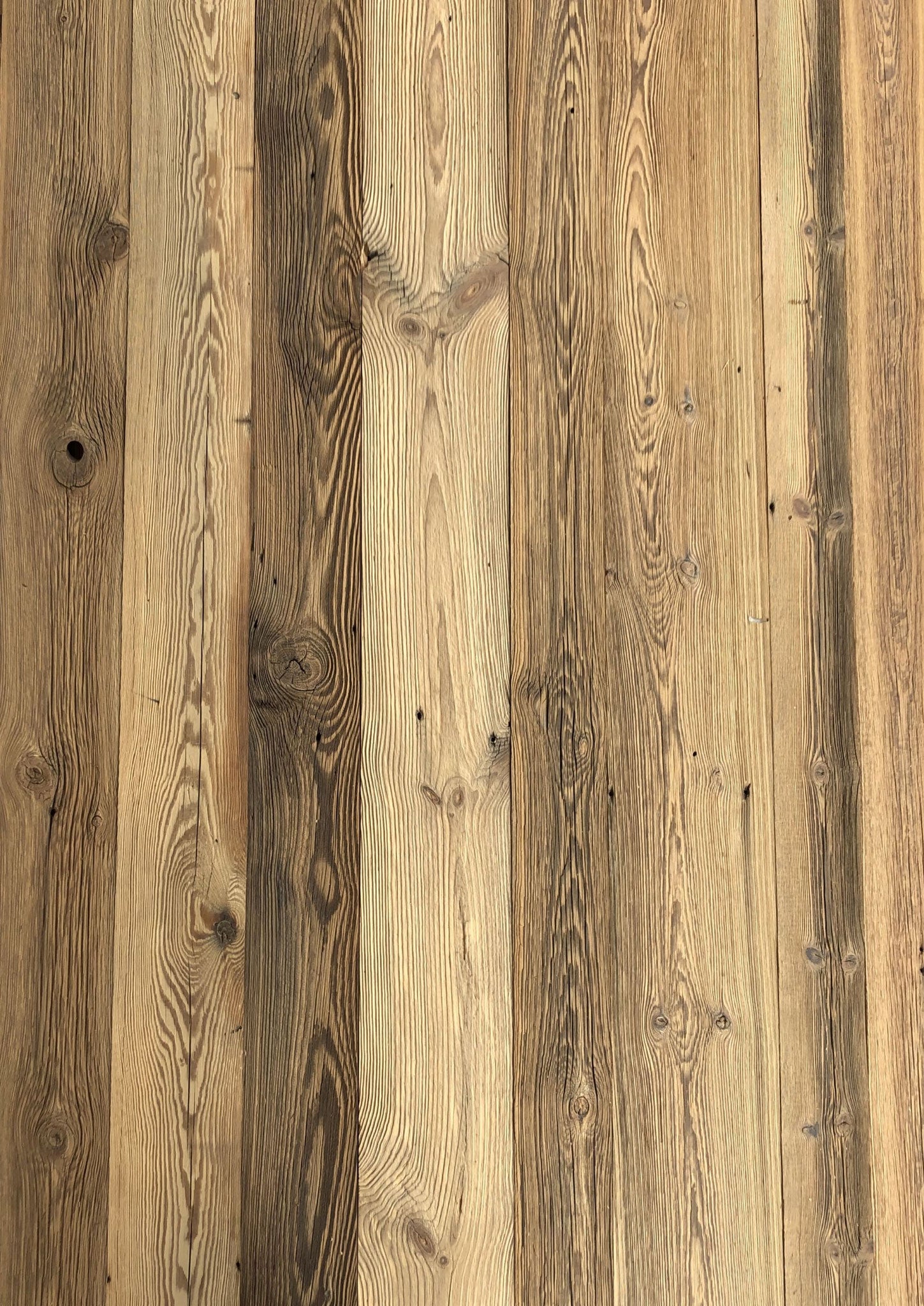 Rustic wall cladding made from sun-aged reclaimed wood