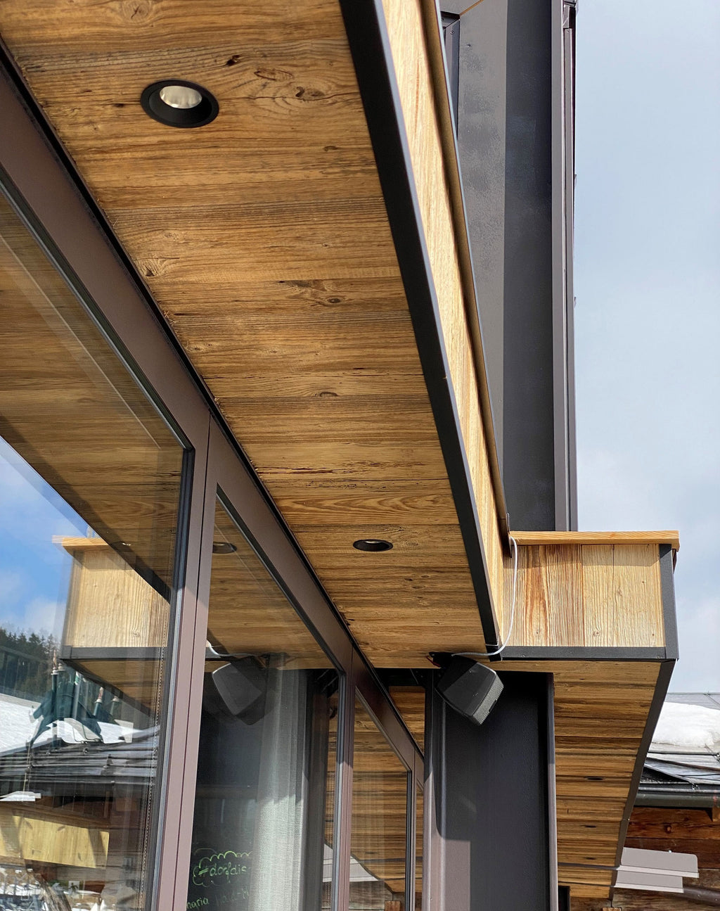 Interior walls clad with naturally aged reclaimed wood